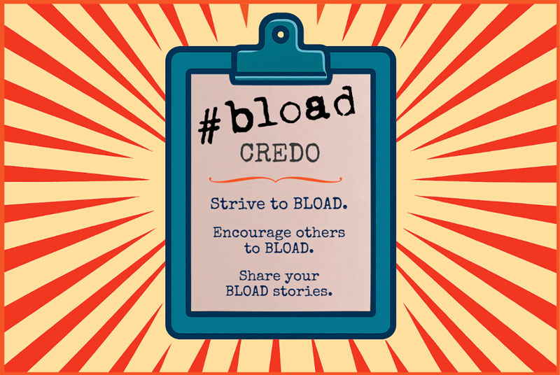 Clipboard with the BLOAD Credo printed on a sheet: Strive to BLOAD, Encourage others to BLOAD, Share your BLOAD stories.